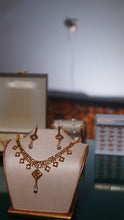 Golden Gold-toned necklace and matching earrings