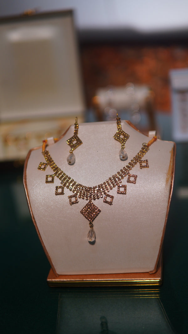 Golden Gold-toned necklace and matching earrings