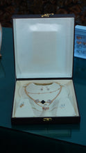 Necklace multiple chains cubic zirconia stone & pearl drop earrings.