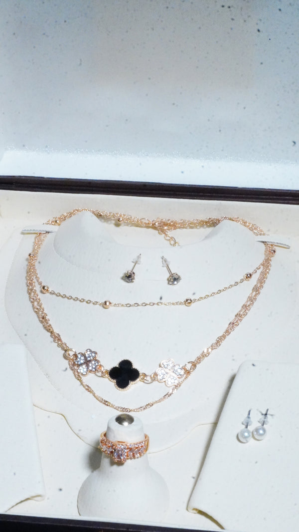 Necklace multiple chains cubic zirconia stone & pearl drop earrings.