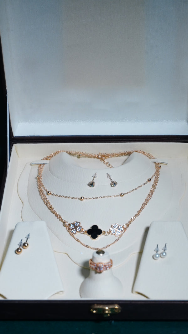 Necklace multiple chains cubic zirconia stone & pearl drop earrings.