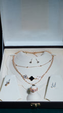 Necklace multiple chains cubic zirconia stone & pearl drop earrings.